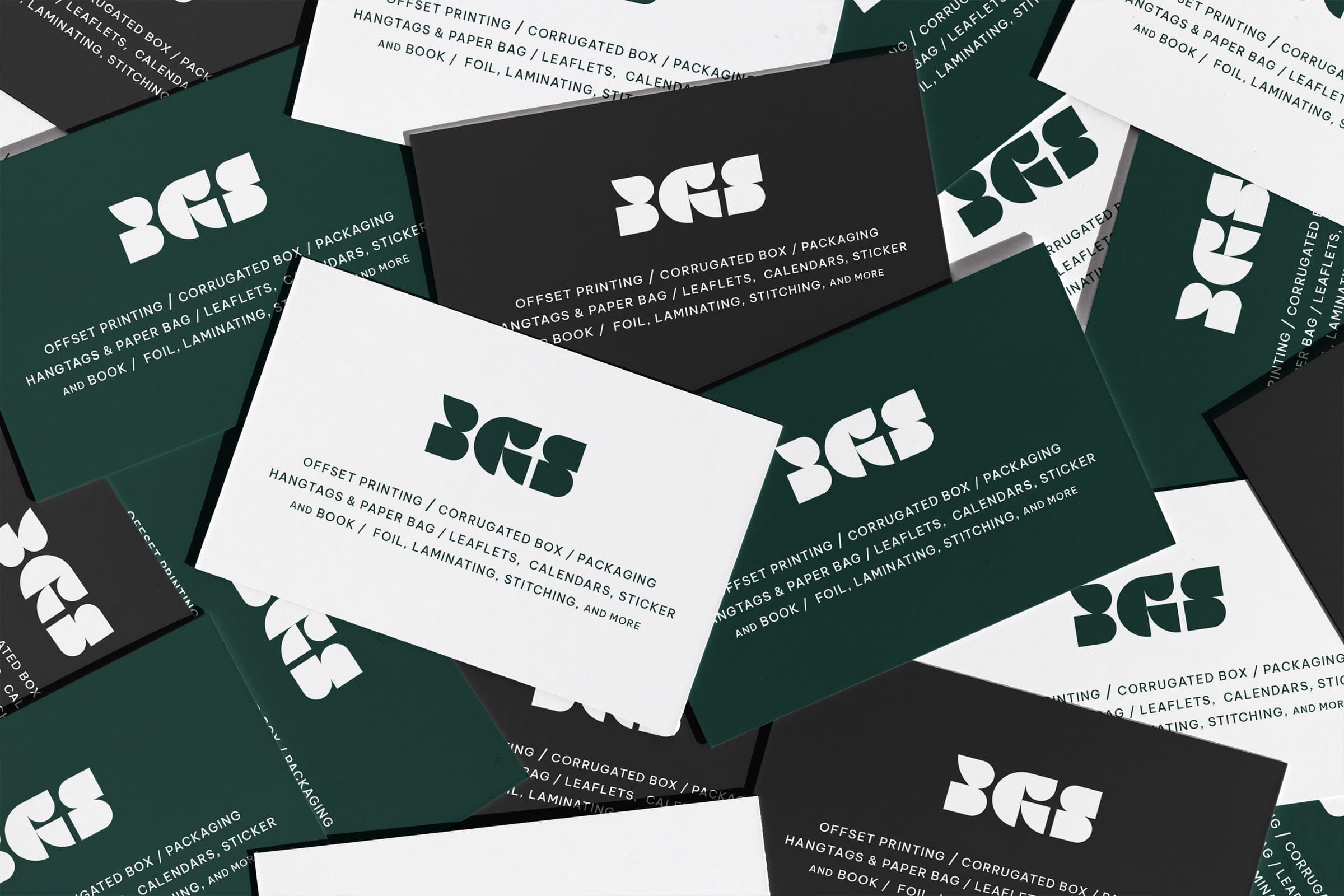 Offset-printed business cards in green, black and white